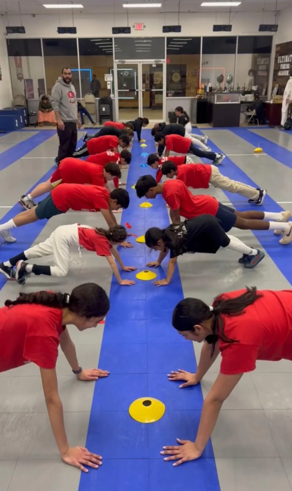 Summer camp fencing drills — students training in formation at Ultimate Fencing Academy
