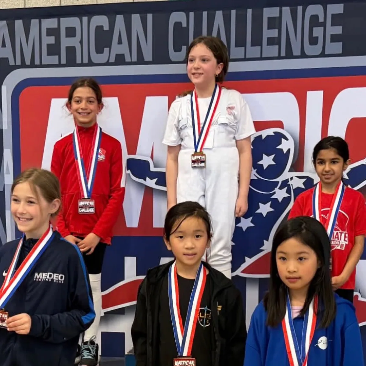 UFA students on the winner's podium at American Challenge national fencing tournament