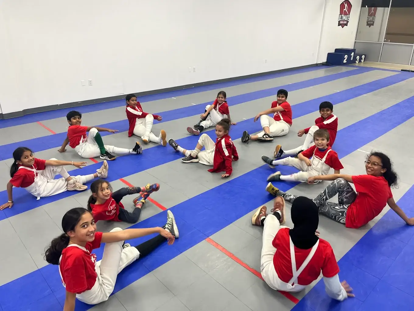 Campers in UFA red shirts warming up together