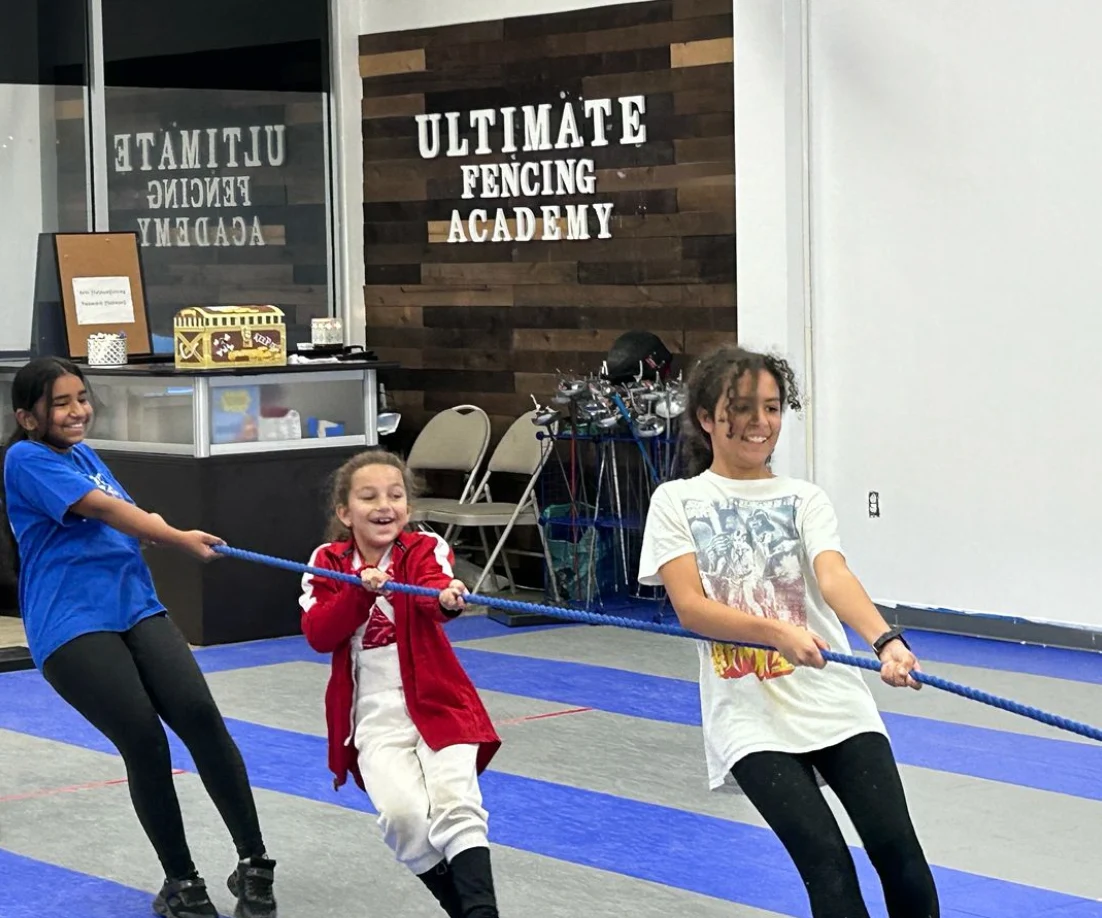 Campers playing tug of war at UFA summer camp