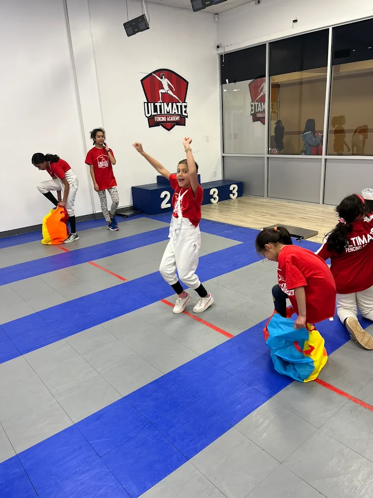 Kids racing in sack race at UFA summer camp